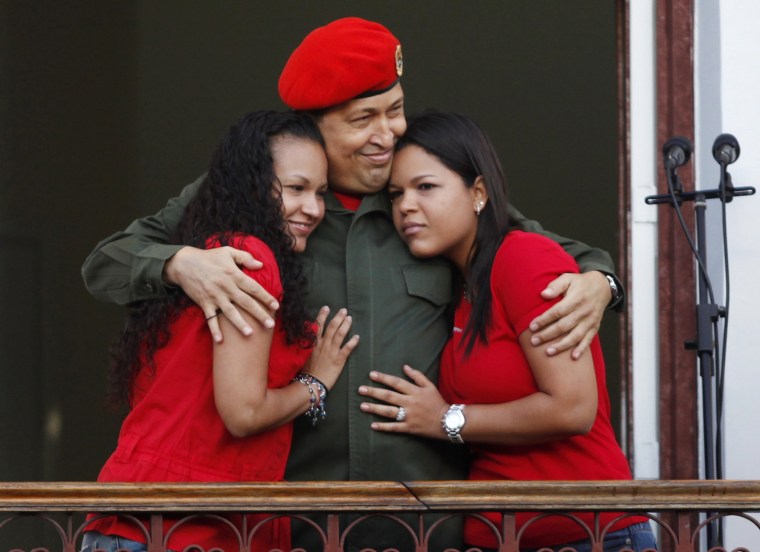 Image: Venezuela's President Hugo Chavez appears to supporters on a balcony of Miraflores Palace in Caracas